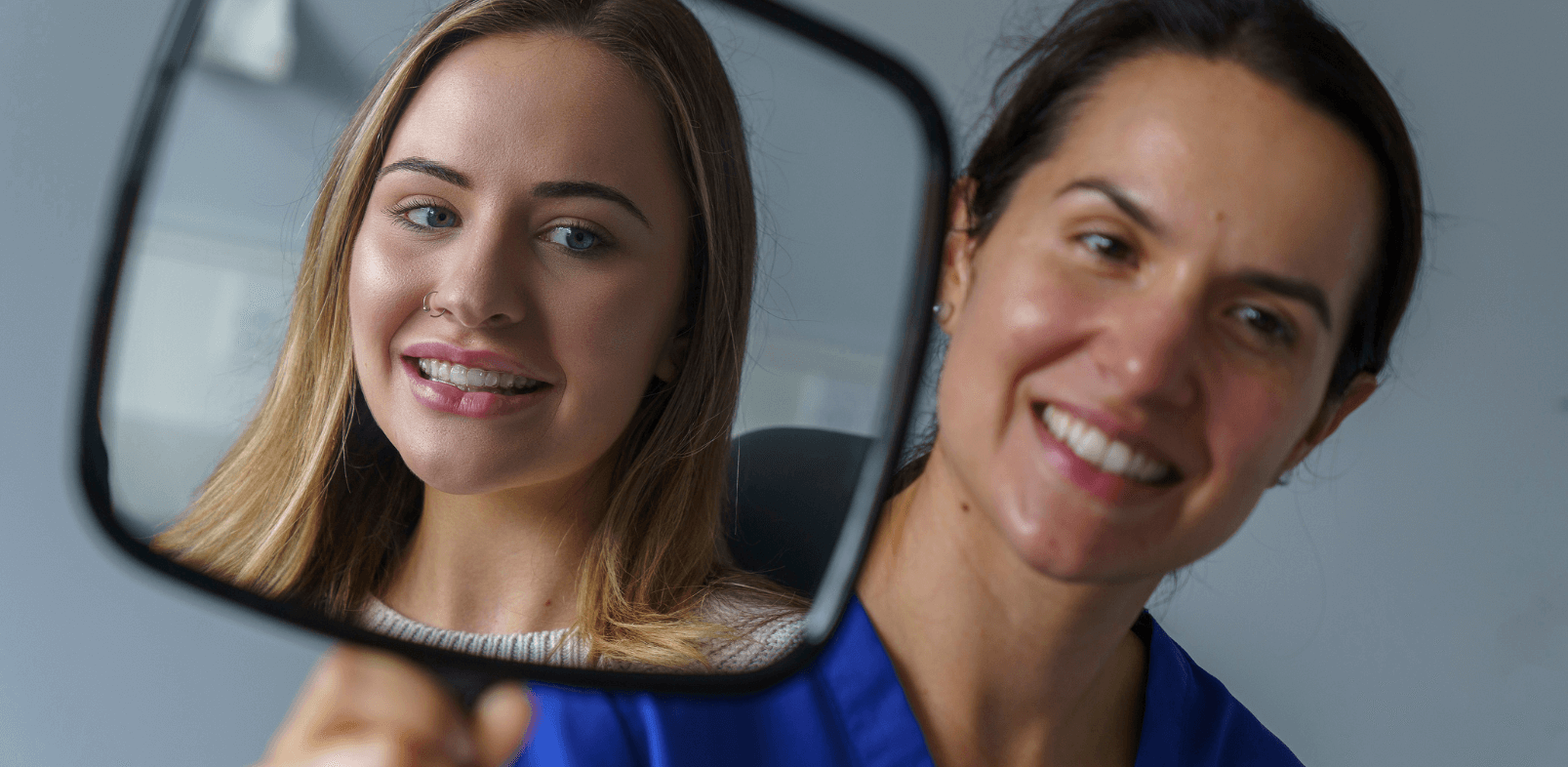 Patient at Boroughbridge Dental Practice looking into mirror at Ripon